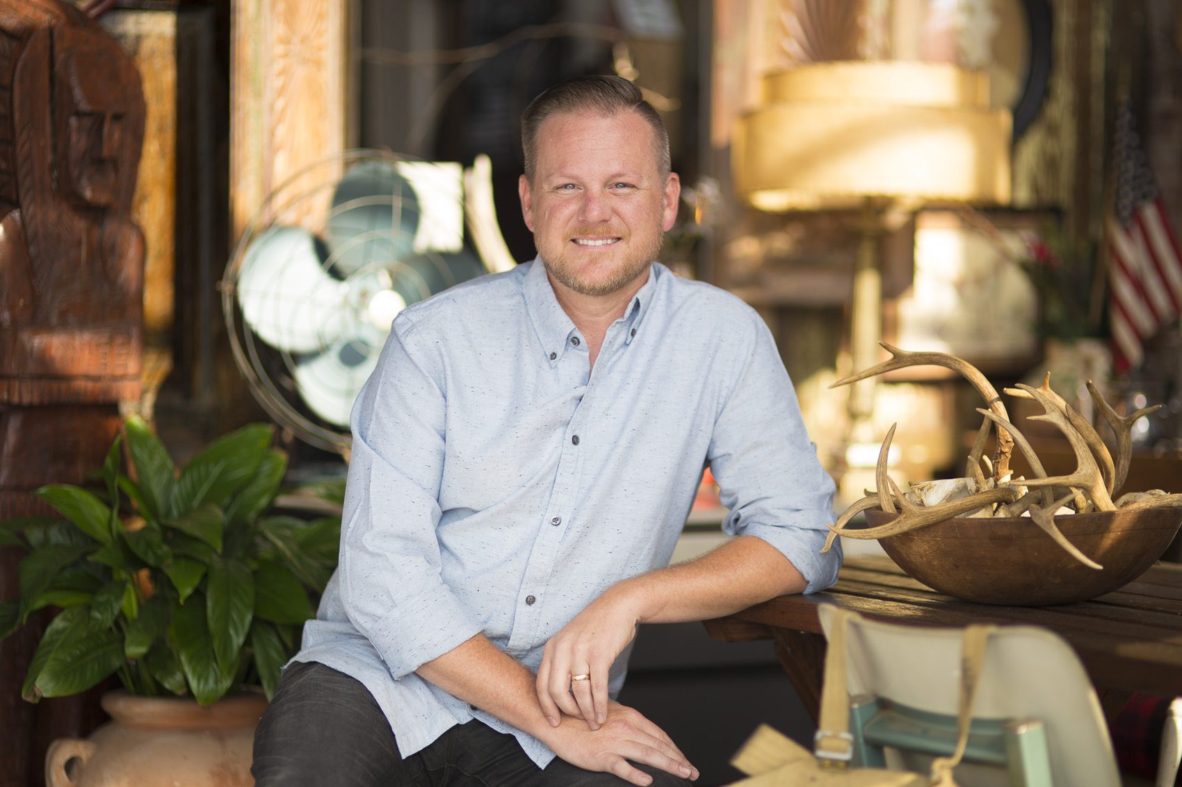 Executive portrait against a glass tower interior