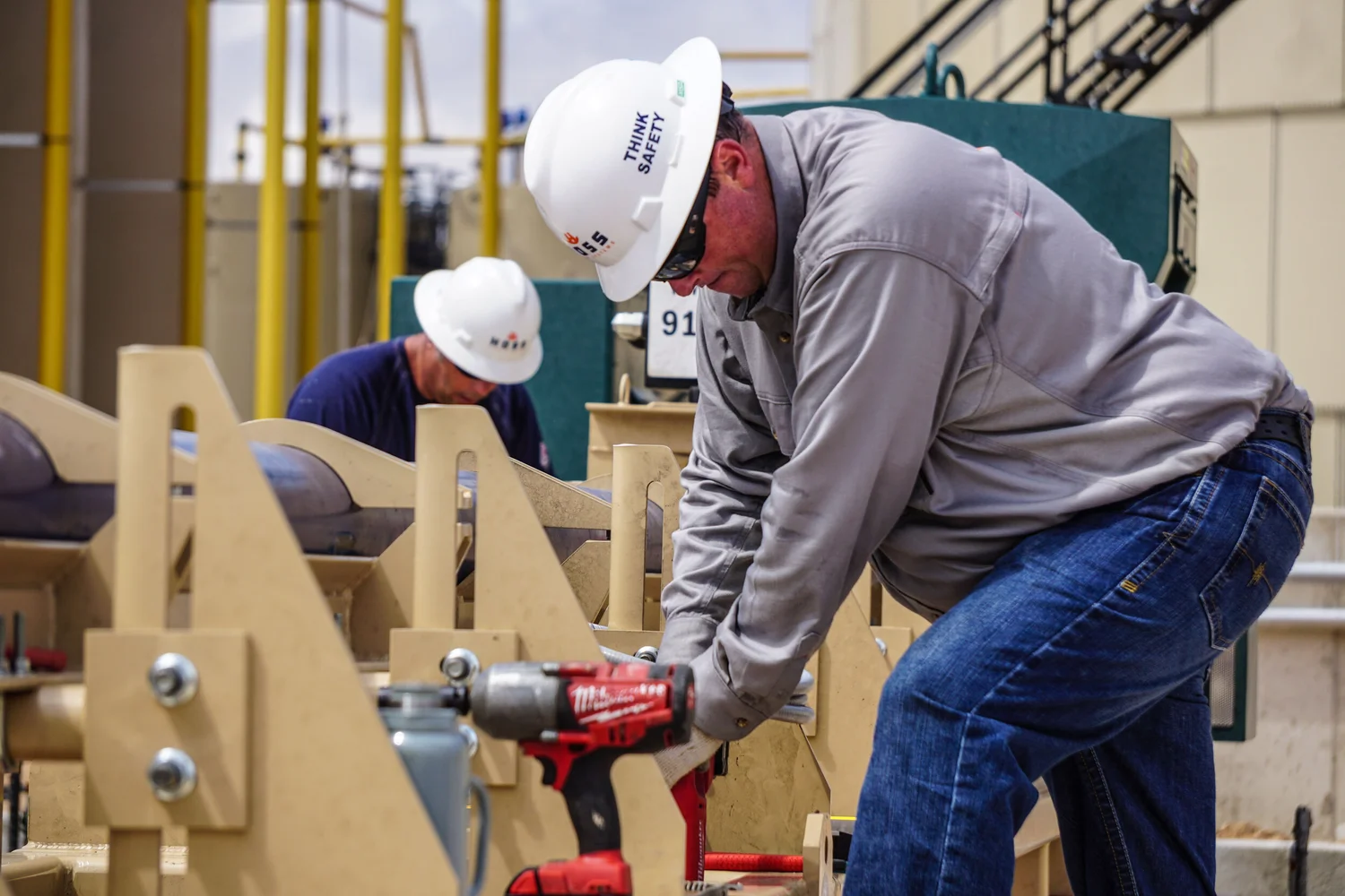 Field technician working directly on industrial equipment