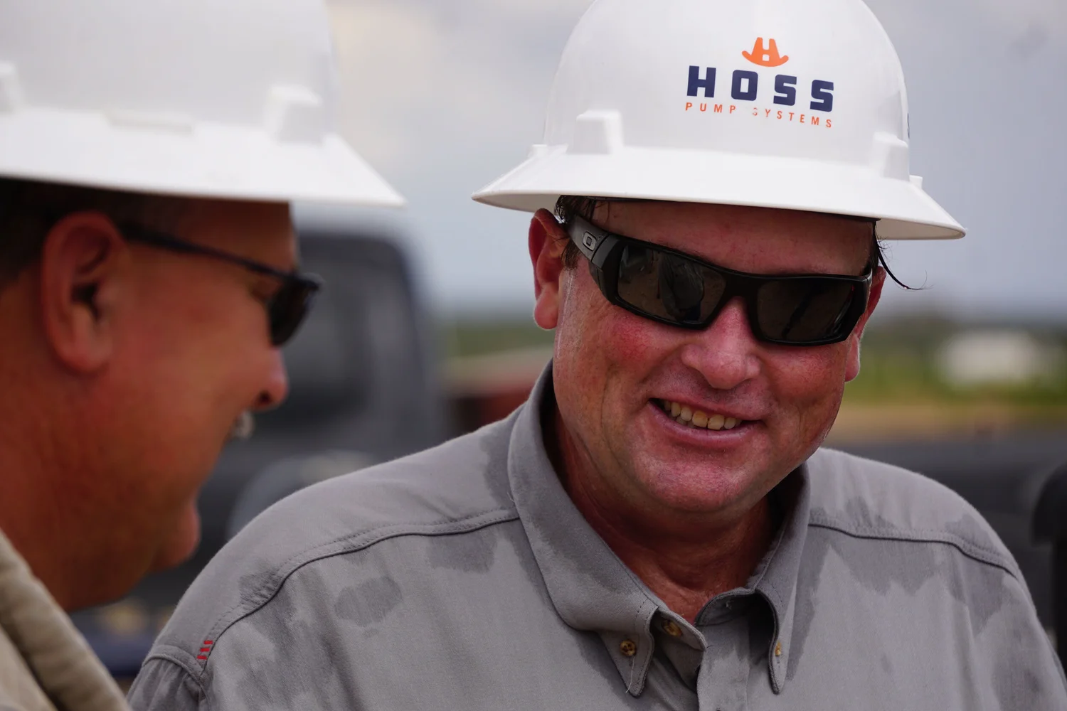 Industrial worker photographed in conversation on location