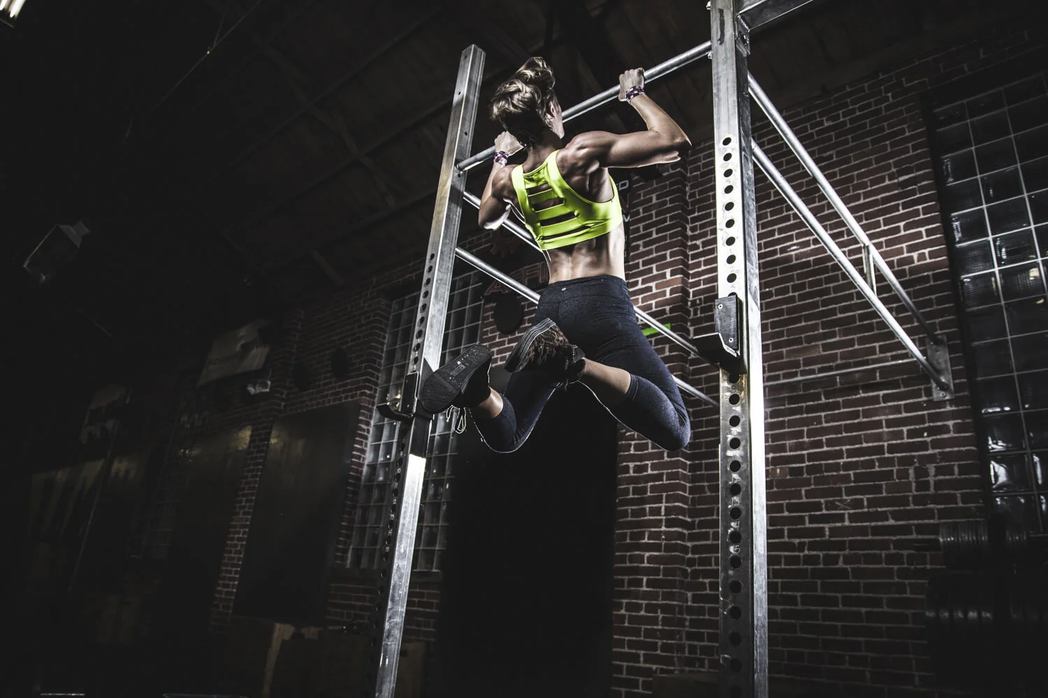 Athlete suspended in a strength and motion campaign