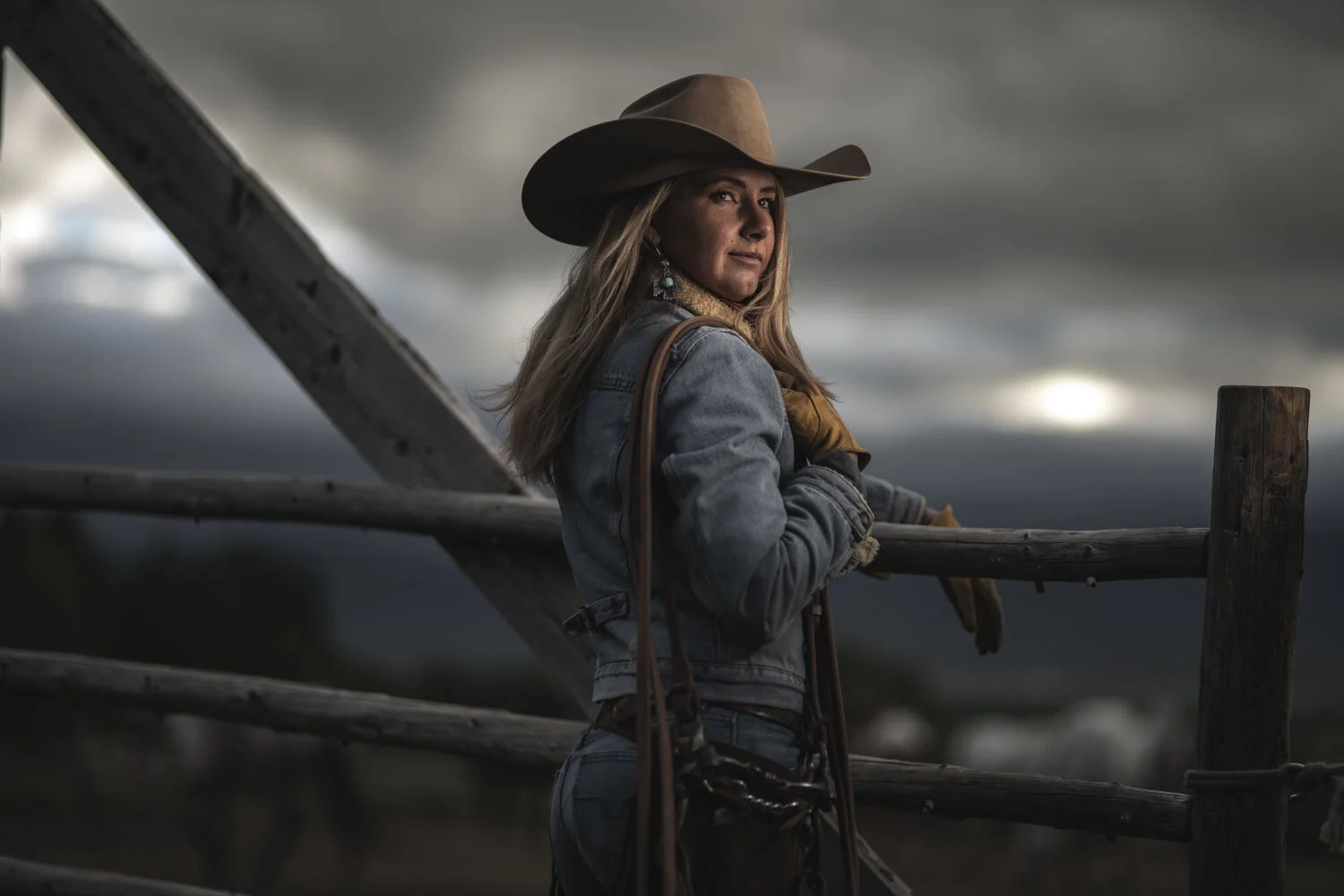 Western woman photographed against weather and open country