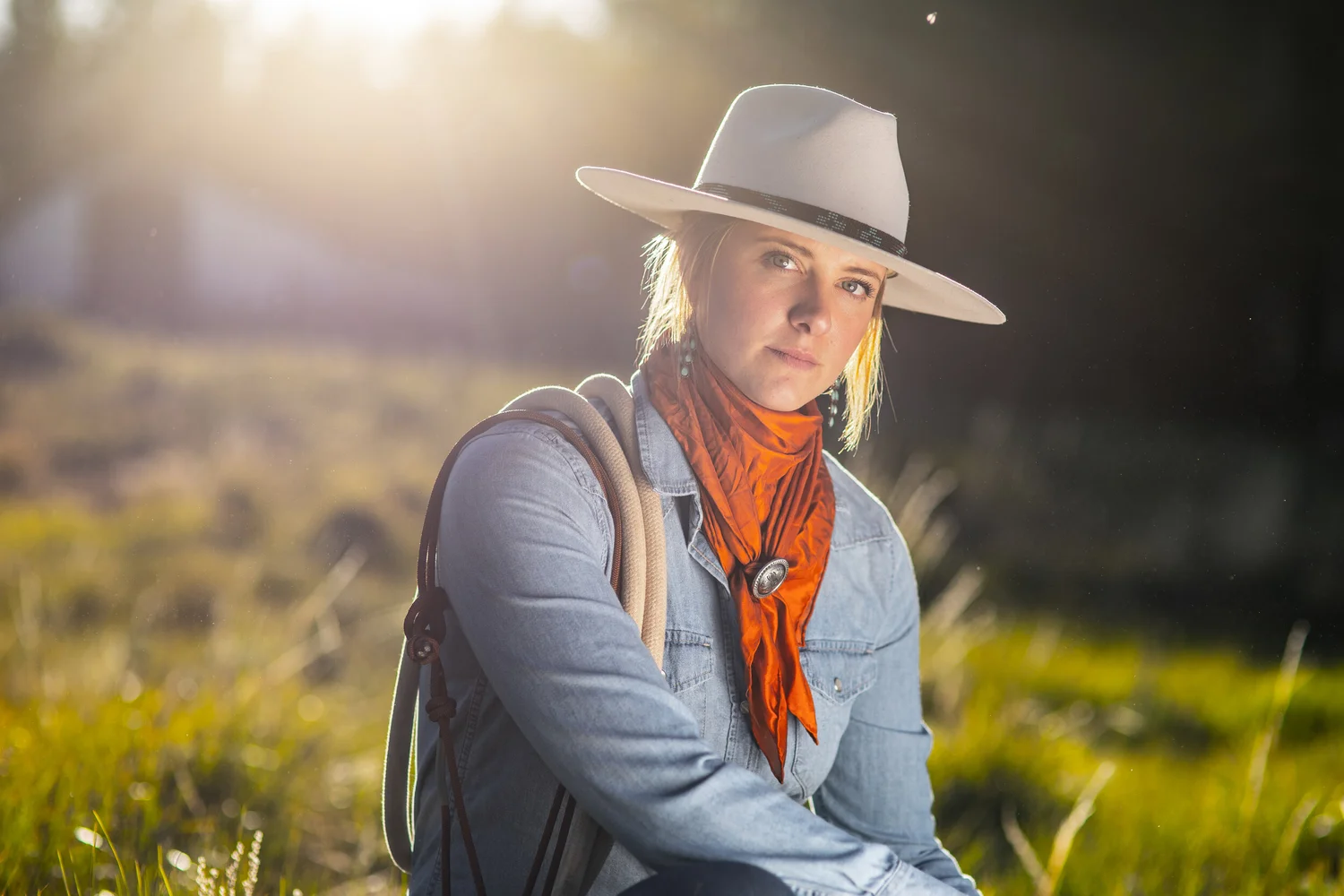 Wyoming horsewoman portrait in hard backlight