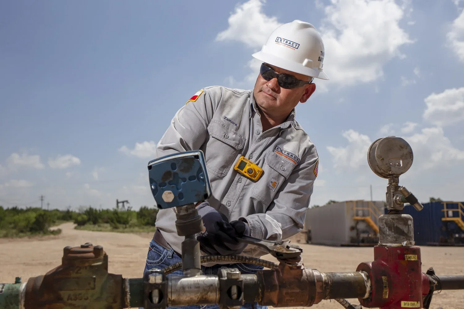 Field technician working directly on active industrial equipment