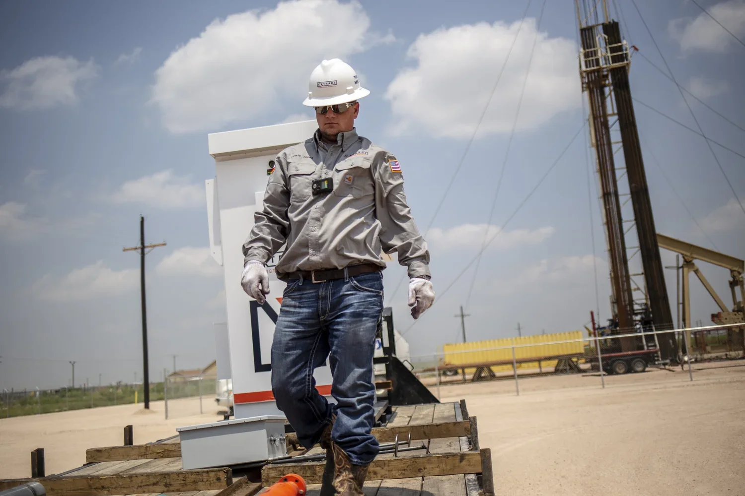 Field technician moving between equipment on an industrial site