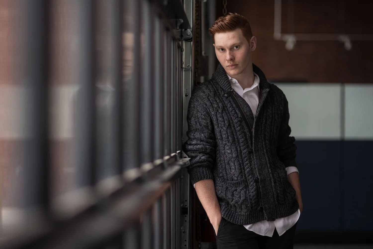 Moody environmental portrait of a young man