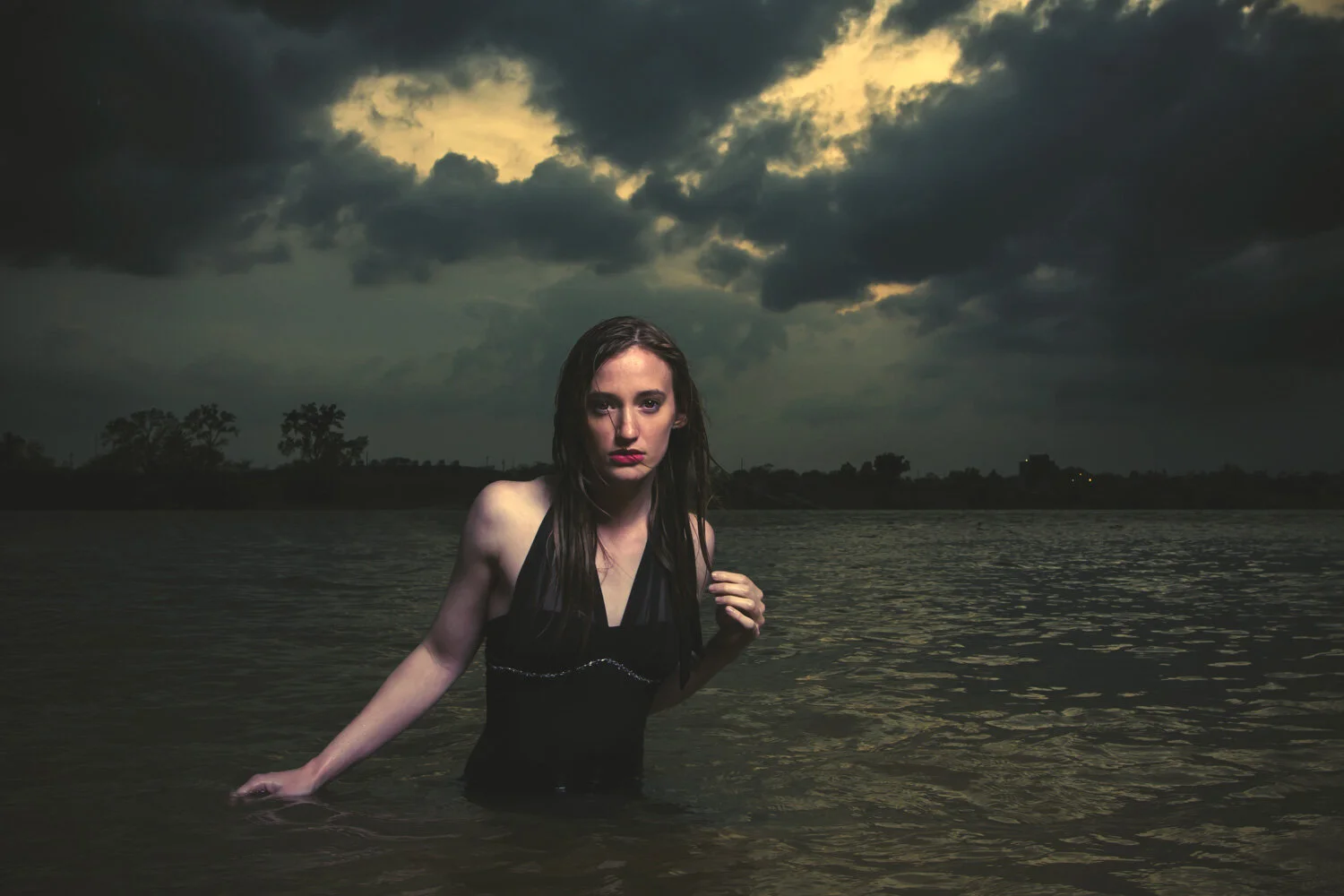 Environmental portrait shaped by dramatic weather and light