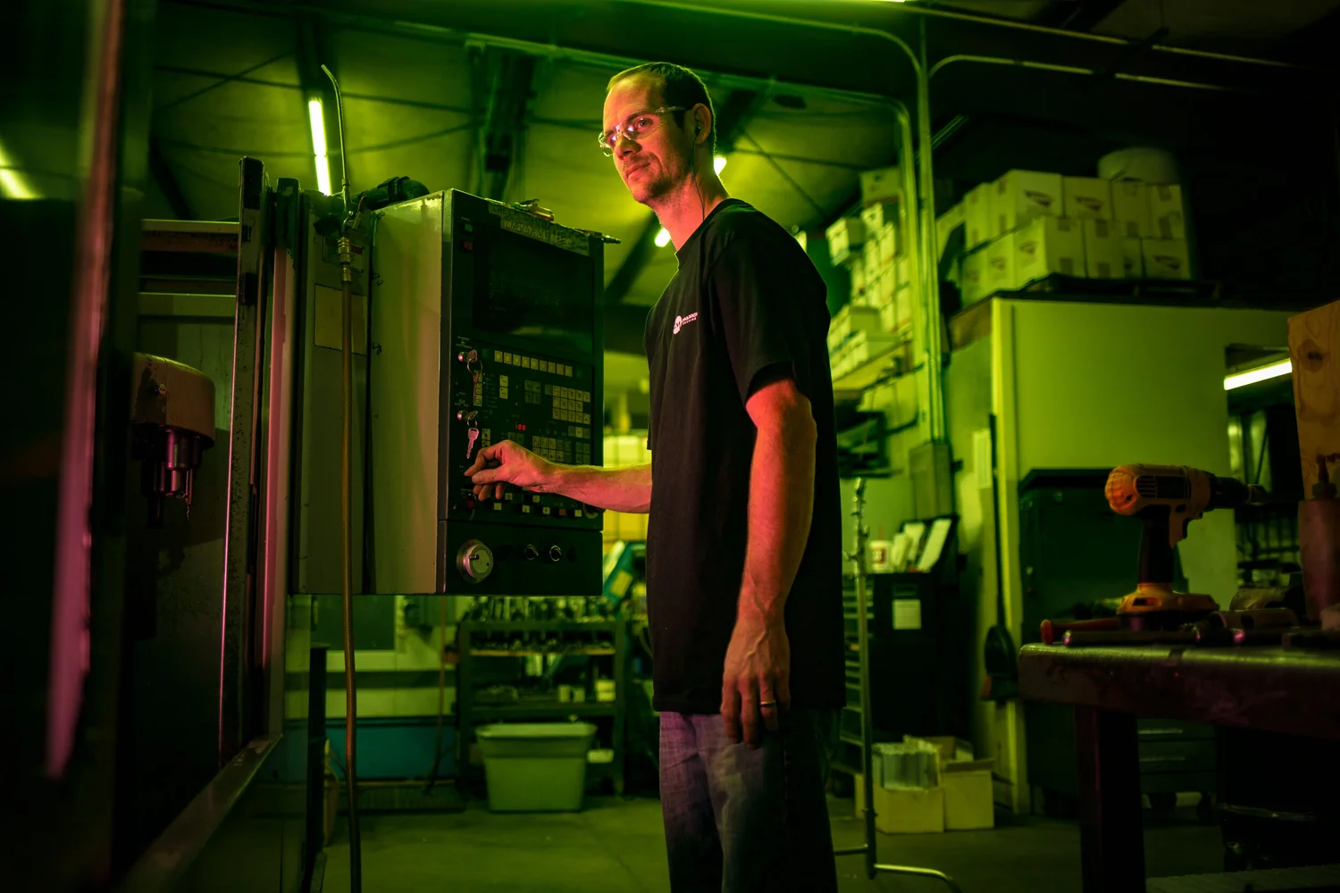 Industrial worker portrait in colored environmental light