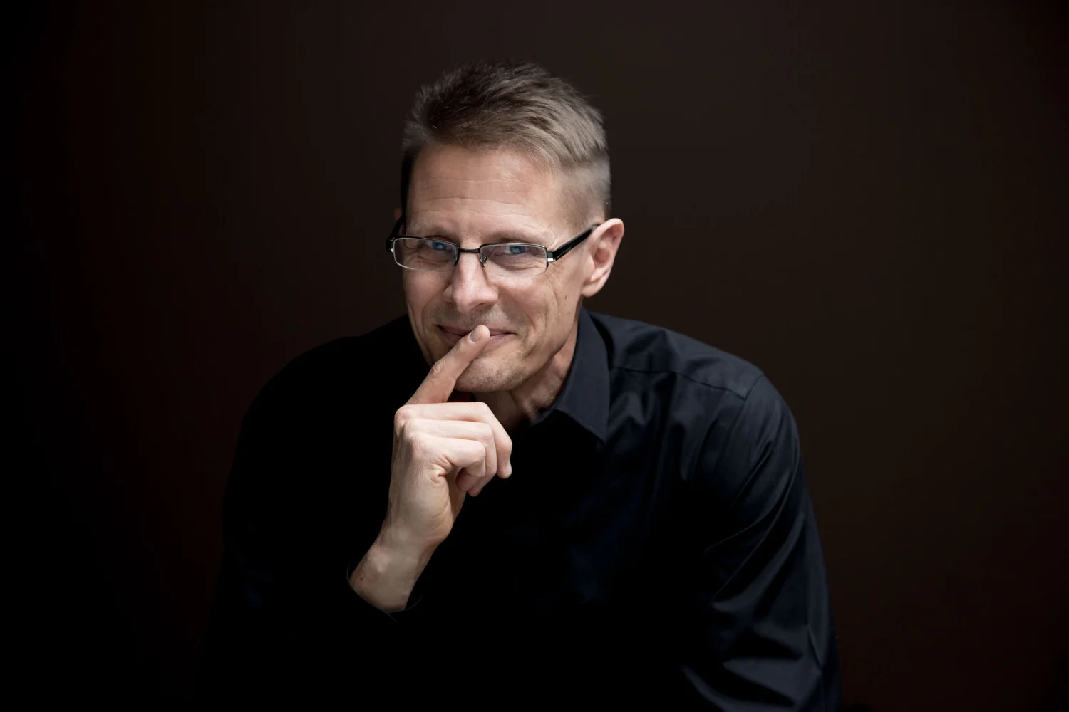 Direct commercial portrait with restrained studio light