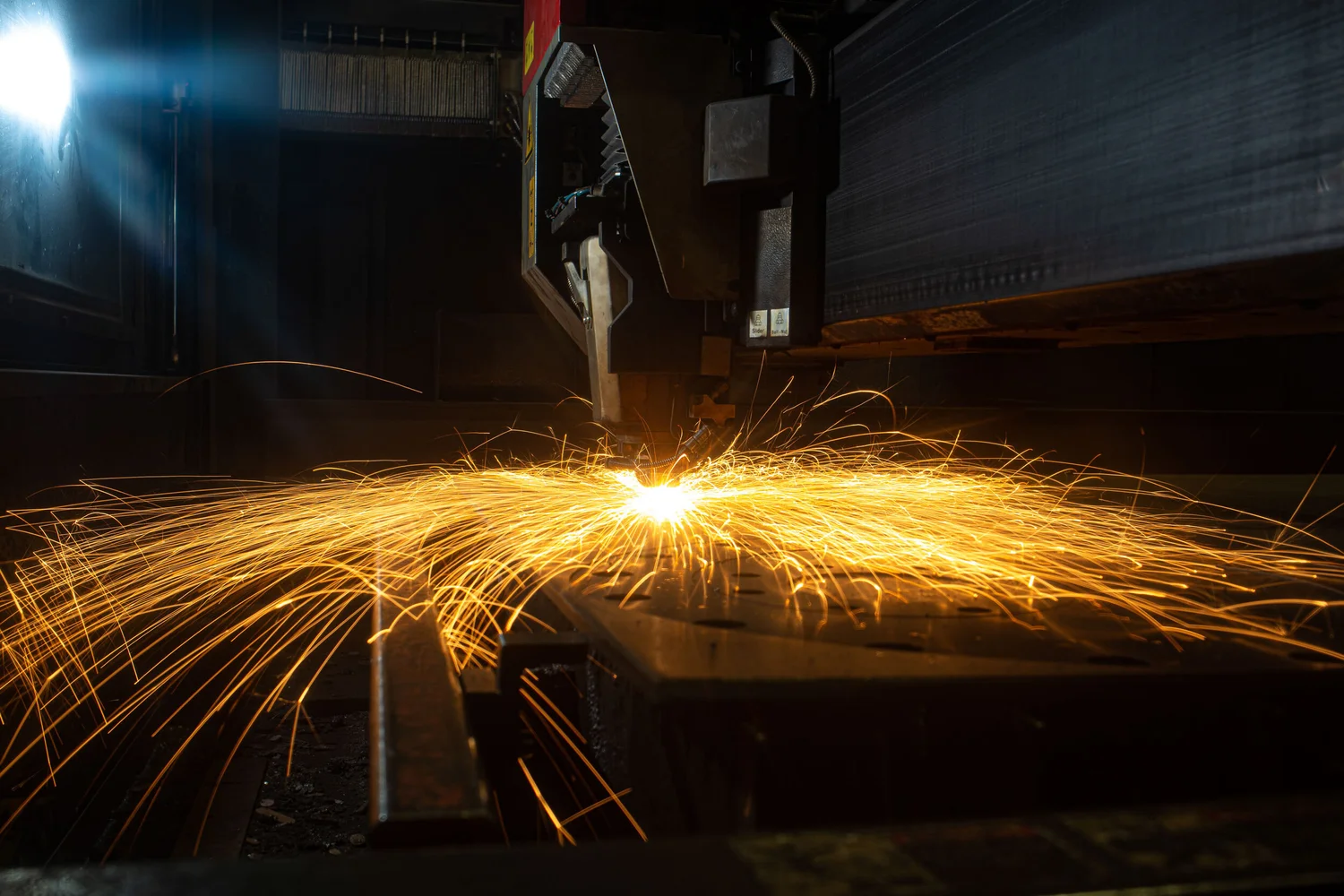 Industrial cutting sparks frozen as a graphic campaign frame