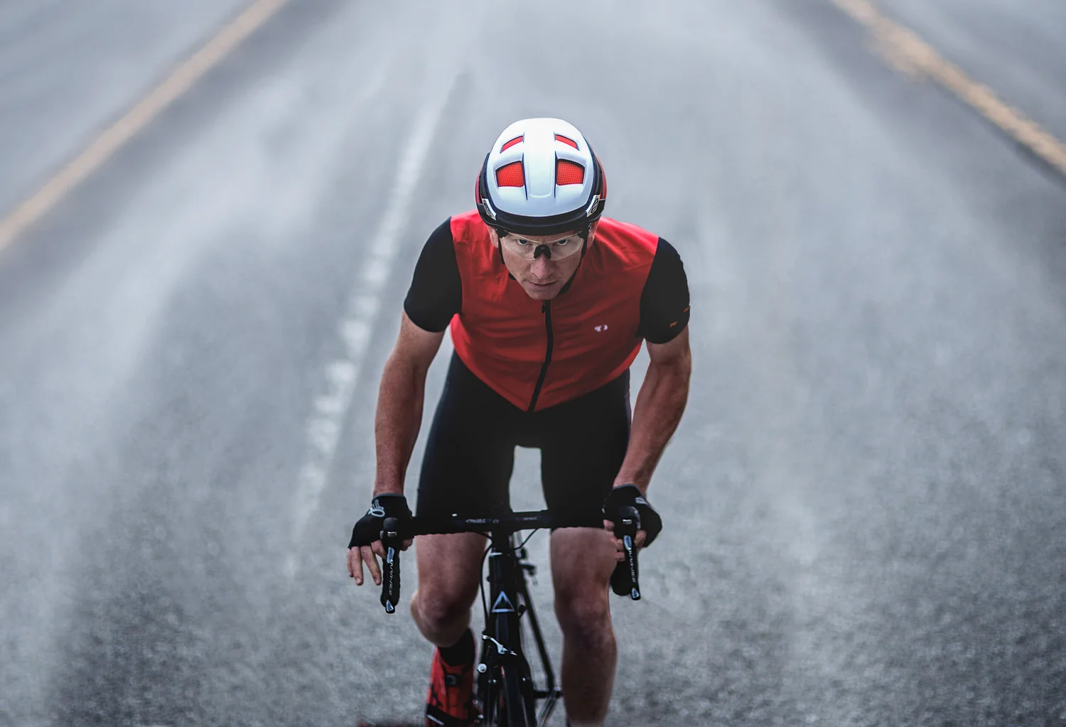 Road cyclist photographed head-on at speed