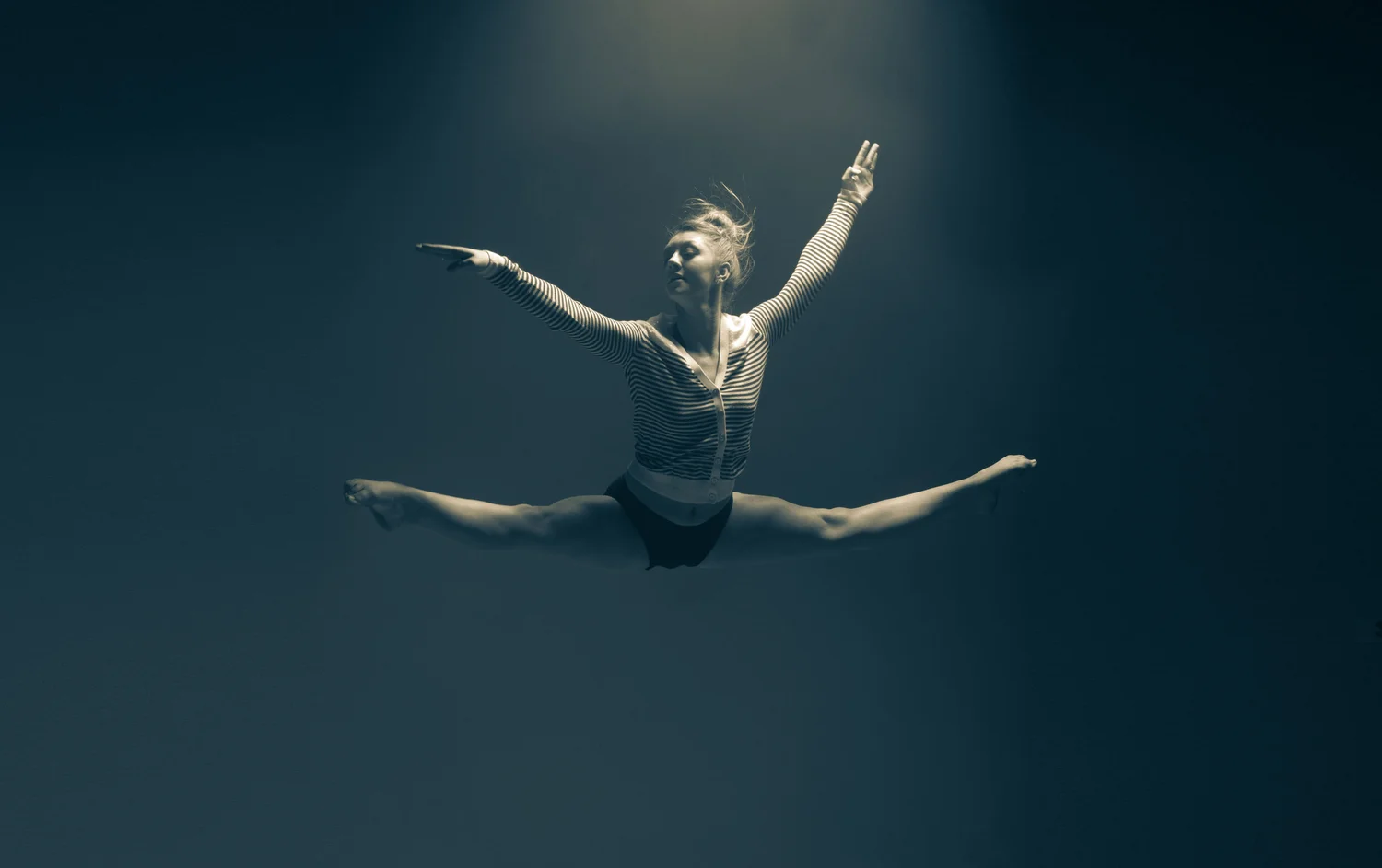 Dancer suspended in controlled light