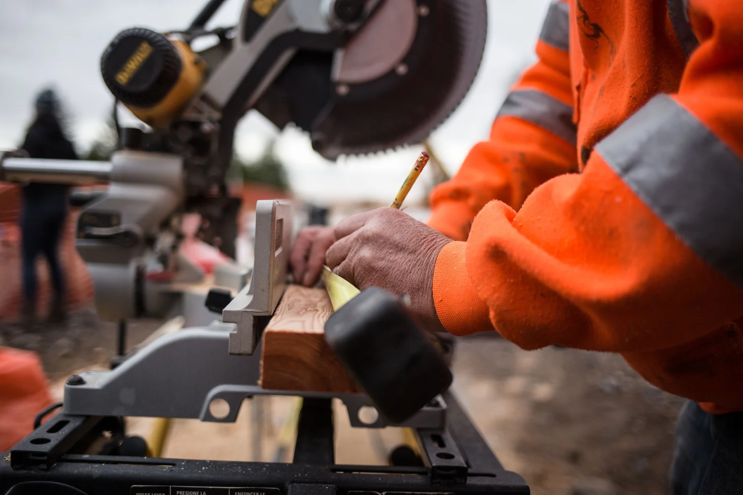 Craftsperson making a precise cut on a job site